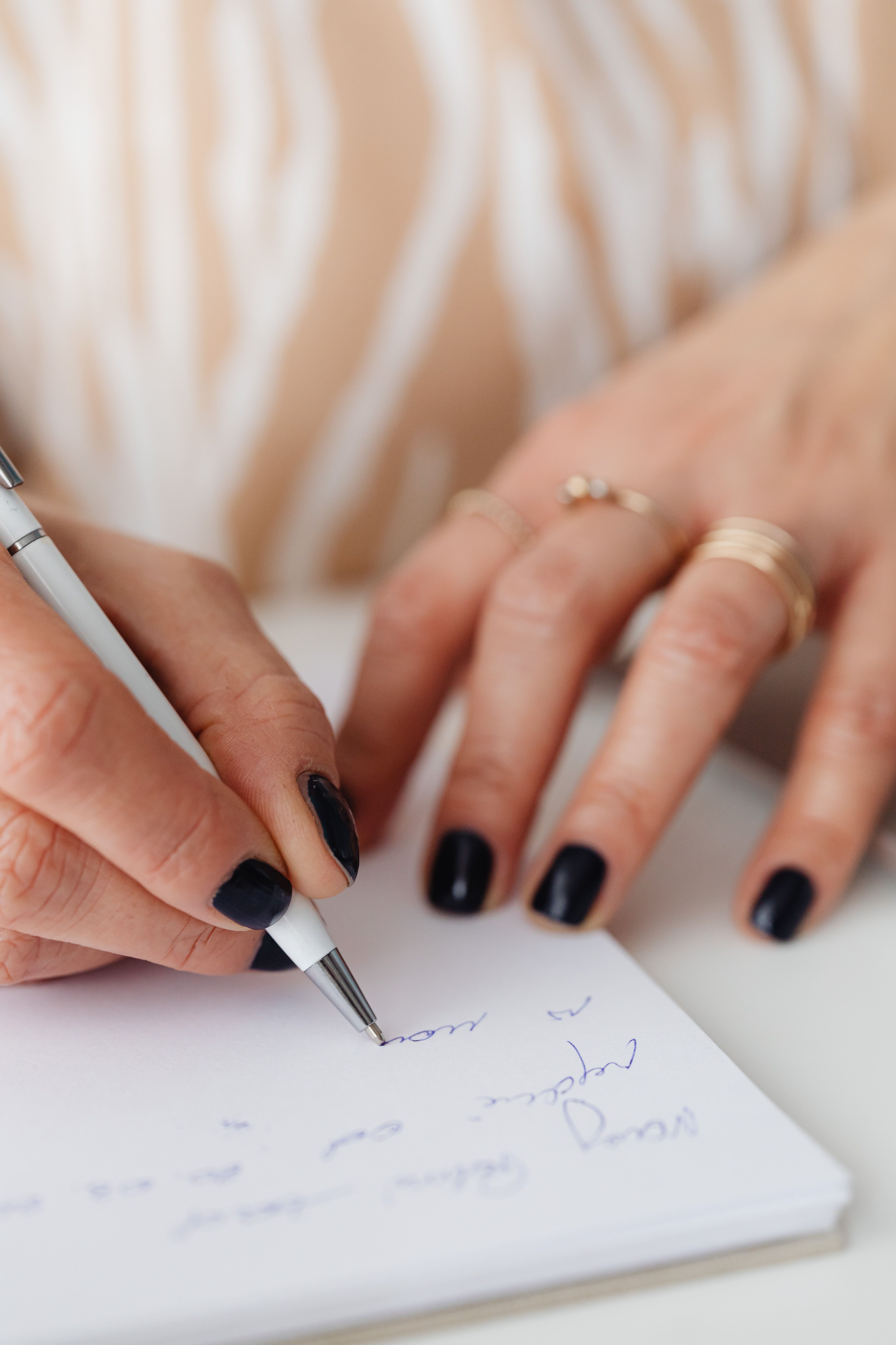 elegant woman hands writing notebook
